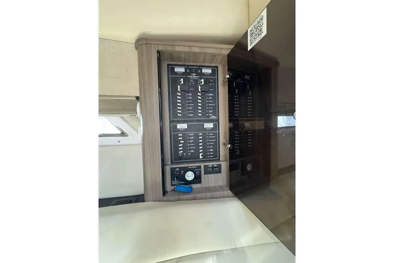 Slide: The Image of Control panel inside 2019 Regal 3350 Sport Cruiser boat cabin. - 13