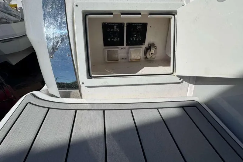 Slide: The Image of 2019 Regal 3350 Sport Cruiser electrical panel and deck view. - 15