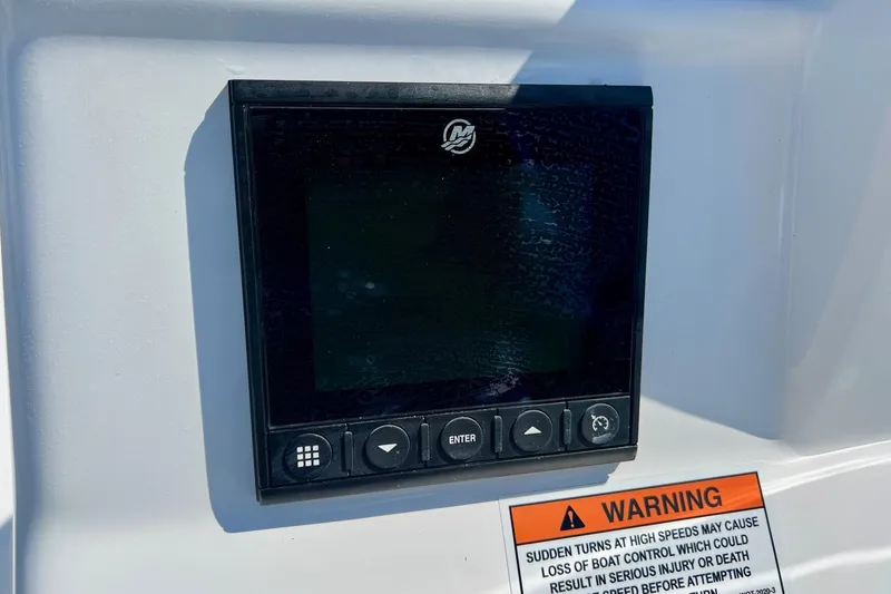 Slide: The Image of Control panel on SCB S22 boat, 2025 model, with warning label below. - 15