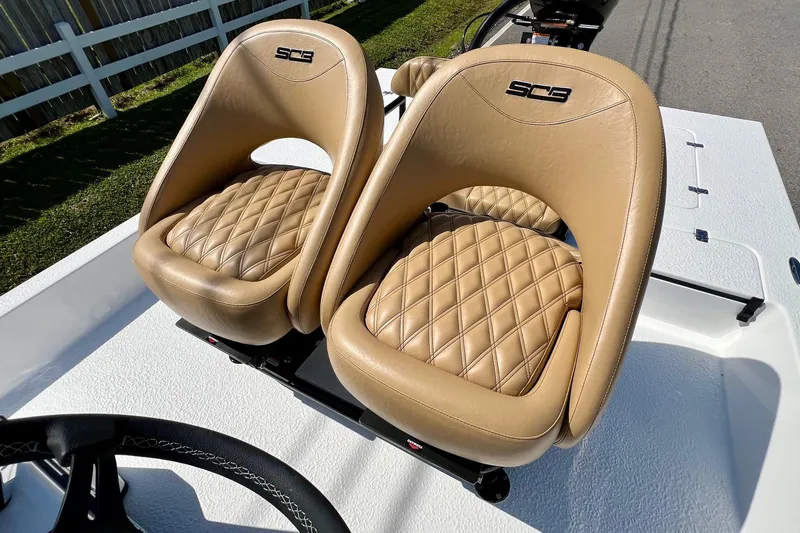 Slide: The Image of Luxurious tan leather seats in 2025 SCB S22 boat, featuring diamond stitching design. - 8