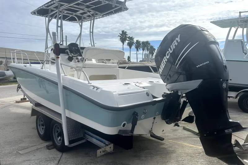 Slide: The Image of 2012 Boston Whaler 230 Dauntless boat with Mercury Verado engine on trailer. - 5