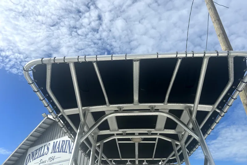 Slide: The Image of Boston Whaler 230 Dauntless 2012 T-top against blue sky at O'Neill's Marina. - 7