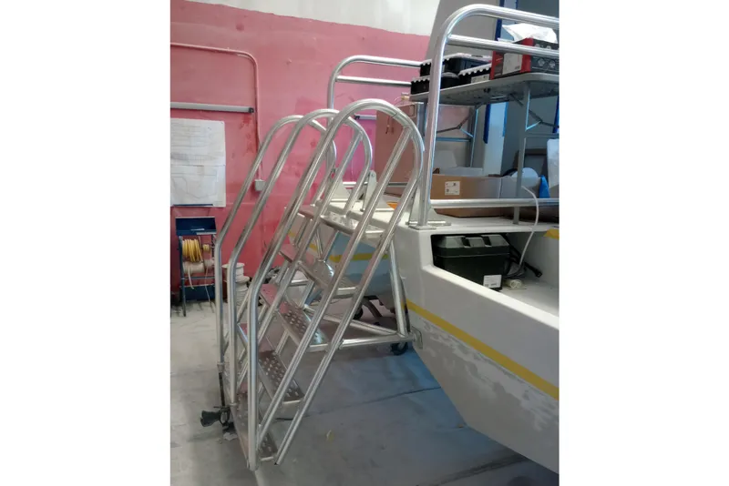 Slide: The Image of Aluminum ladder on 2026 Custom Passenger Catamaran BYD34 in workshop setting. - 11