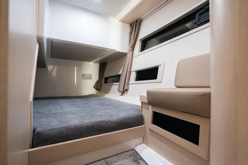 Slide: The Image of Interior cabin of 2026 Aquador 400HT boat, featuring modern design and comfortable seating. - 17