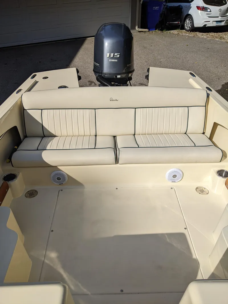 Slide: The Image of 2022 Rossiter 17 boat interior with beige seating and 115 HP outboard motor. - 5