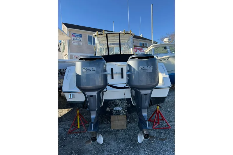 Slide: The Image of 2005 Pursuit 3070 Offshore boat with twin 250 horsepower outboard engines. - 2