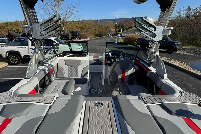 Slide: The Image of 2023 MasterCraft XT20 boat interior with sleek seating and modern design. - 12