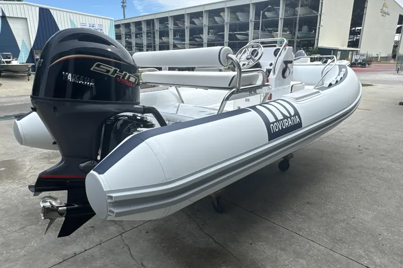 Slide: The Image of Overhead view of 2025 Novurania DL 460 inflatable boat with outboard motor. - 4