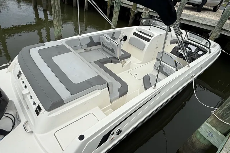 Slide: The Image of 2023 Bayliner VR6 Bowrider OB docked, featuring spacious seating and sleek design. - 6