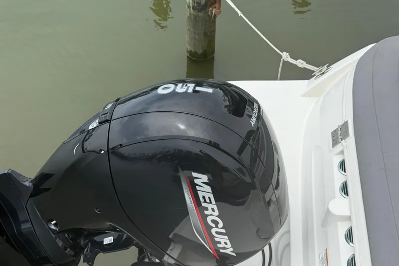 Slide: The Image of 2023 Bayliner VR6 Bowrider OB with Mercury outboard motor, docked on calm water. - 7