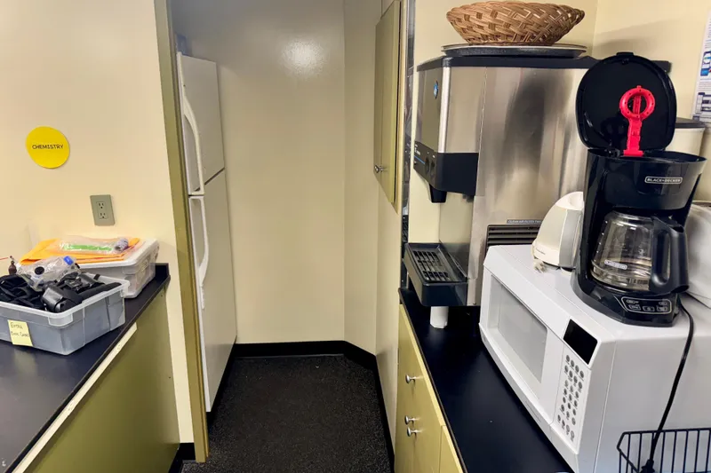 Slide: The Image of Kitchen area on a 2016 Custom Commercial Research Riverboat with appliances and storage. - 12