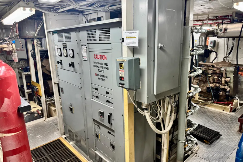 Slide: The Image of Engine room of a 2016 Custom Commercial Research Riverboat with control panels and machinery. - 13