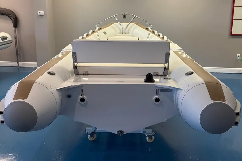 Slide: The Image of 2025 Novurania DL 400 inflatable boat in showroom, featuring sleek design and modern controls. - 3