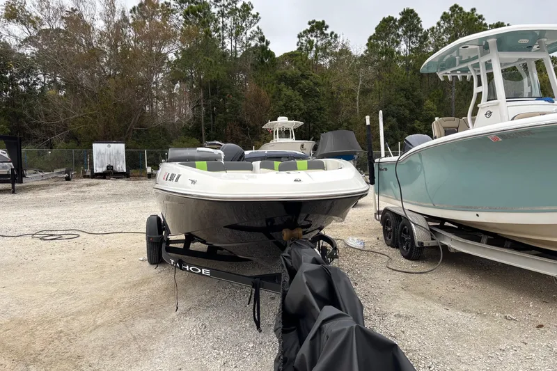 Slide: The Image of 2022 Tahoe T16 boat on trailer in outdoor storage area. - 5