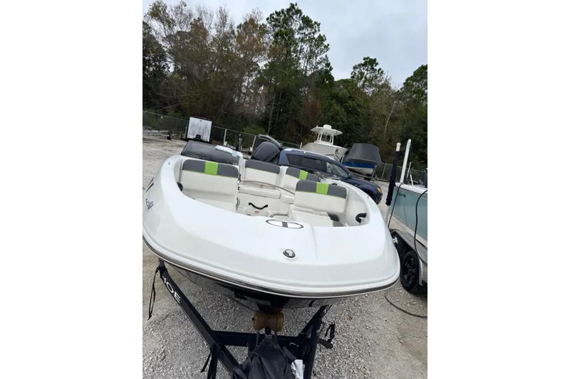 Slide: The Image of 2022 Tahoe T16 boat on trailer in outdoor storage area. - 6