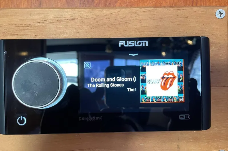 Slide: The Image of Fusion stereo system displaying "Doom and Gloom" by The Rolling Stones on Ocean 38 Super Sport, 1986. - 24