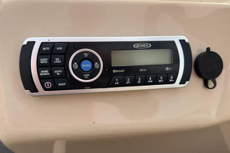 Slide: The Image of JENSEN audio system on 2017 SUNTRACKER TRI-TOON boat, featuring Bluetooth connectivity. - 38
