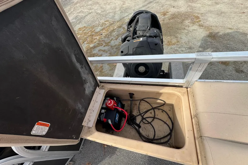 Slide: The Image of 2017 SUNTRACKER TRI-TOON boat battery compartment with cables and equipment. - 43