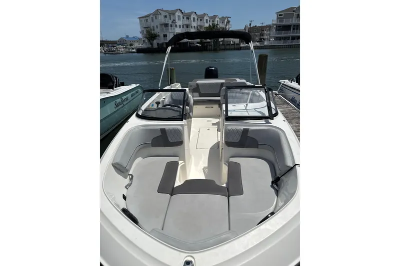 Slide: The Image of 2023 Bayliner VR6 Bowrider OB docked, showcasing spacious seating and sleek design. - 1