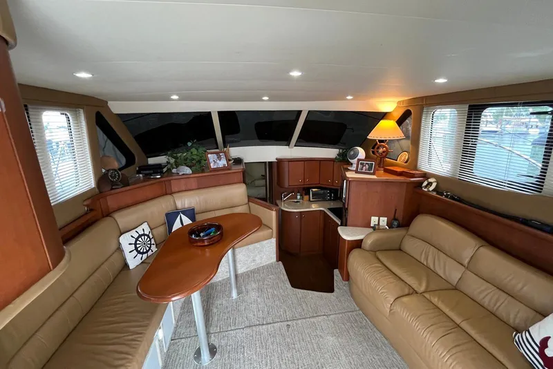 Slide: The Image of Luxurious interior of 2005 Silverton 34 Convertible yacht with leather seating and elegant decor. - 26
