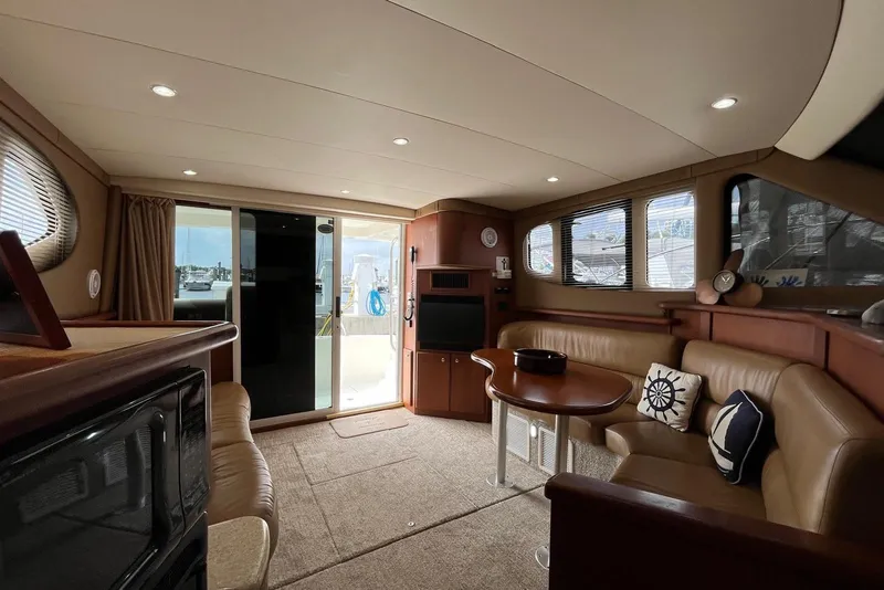 Slide: The Image of Luxurious interior of 2005 Silverton 34 Convertible yacht with plush seating and elegant decor. - 30