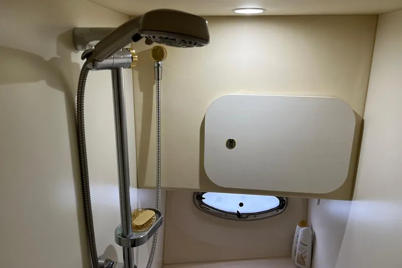 Slide: The Image of Shower area in 2005 Silverton 34 Convertible yacht with modern fixtures and storage. - 34