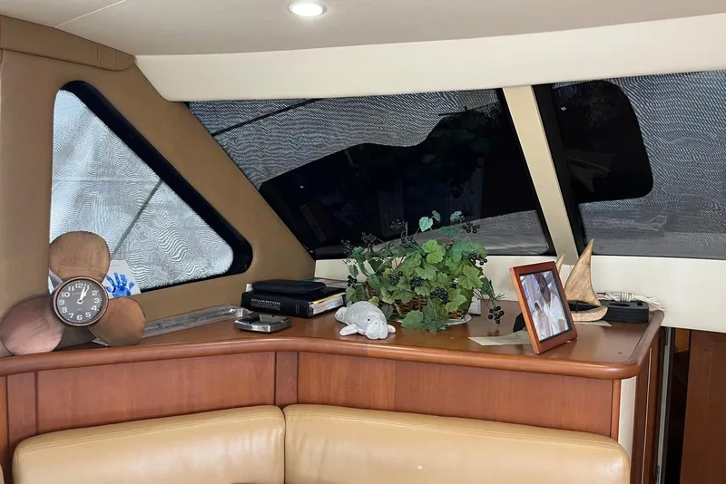 Slide: The Image of Interior of 2005 Silverton 34 Convertible with decor and personal items on display. - 37