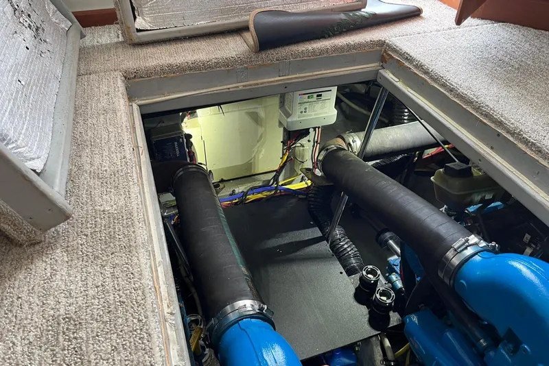 Slide: The Image of Engine compartment of a 2005 Silverton 34 Convertible boat, showing mechanical components and wiring. - 40