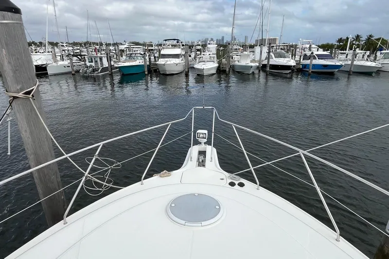 Slide: The Image of Bow view of 2005 Silverton 34 Convertible yacht docked in a marina. - 5