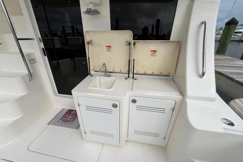 Slide: The Image of 2005 Silverton 34 Convertible yacht sink and storage area on deck. - 7