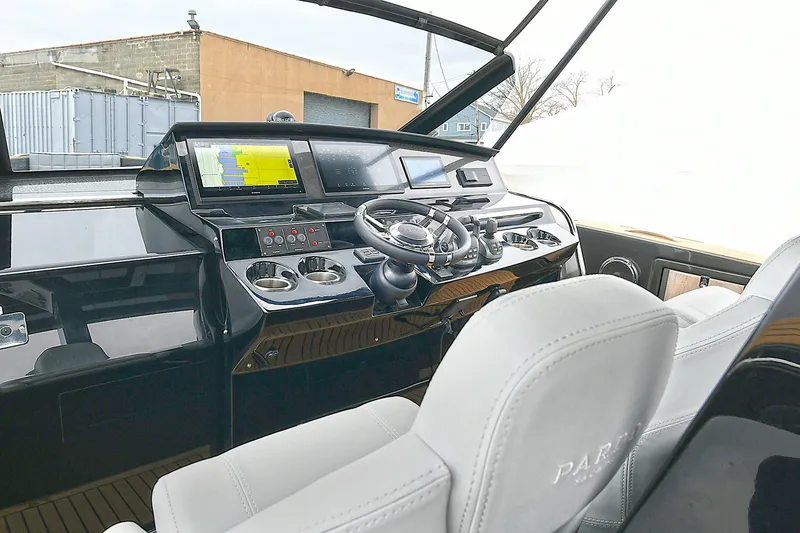 Slide: The Image of Cockpit of 2023 Pardo Yachts 43, featuring modern navigation and control systems. - 14