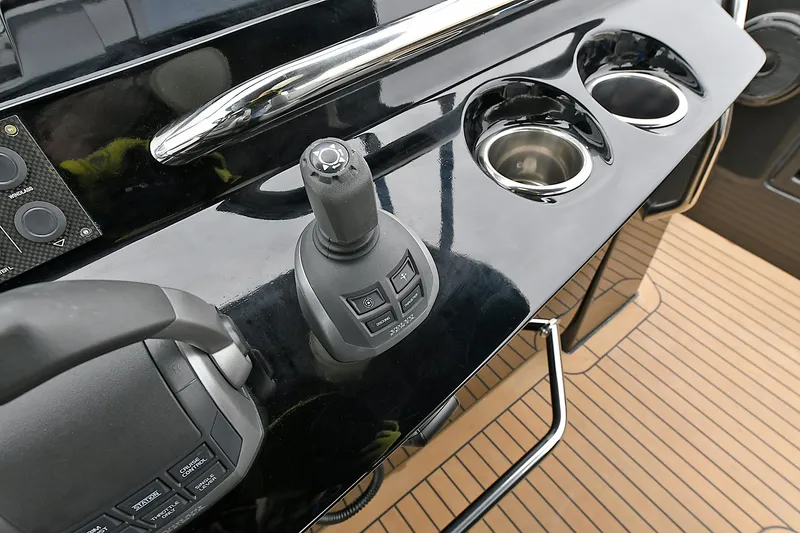 Slide: The Image of Control panel of 2023 Pardo Yachts 43 with joystick and cup holders. - 17