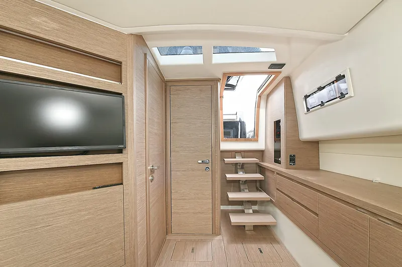 Slide: The Image of Interior of 2023 Pardo Yachts 43, featuring modern wood finishes and a sleek design. - 27