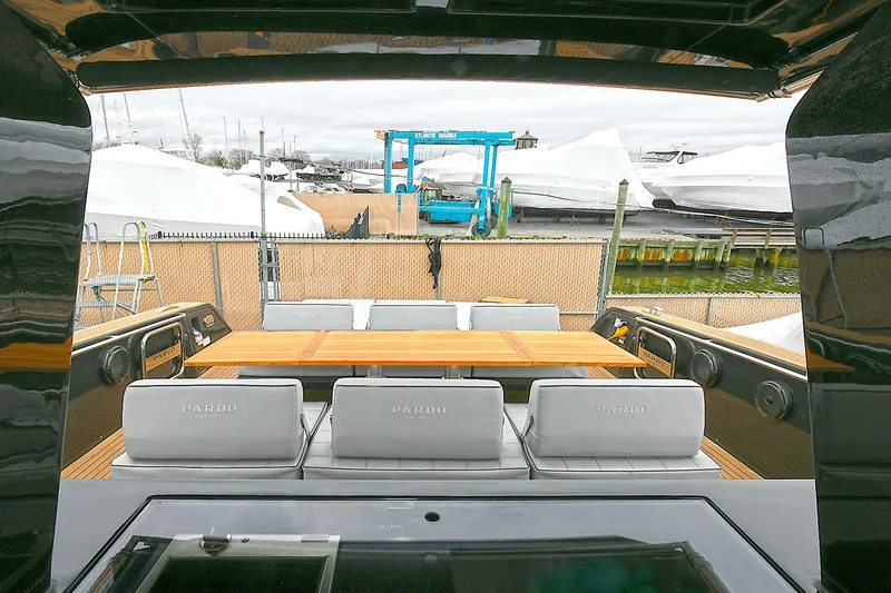 Slide: The Image of 2023 Pardo Yachts 43 interior with sleek seating and wooden table. - 9
