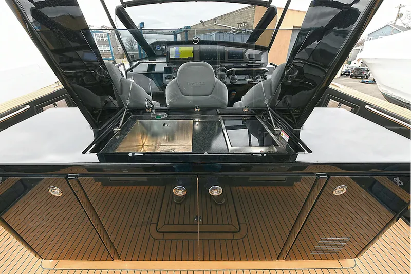 Slide: The Image of 2023 Pardo Yachts 43 interior with sleek black cabinetry and modern helm station. - 10