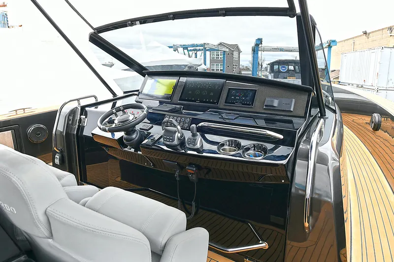 Slide: The Image of 2023 Pardo Yachts 43 cockpit with modern navigation controls and luxurious seating. - 15