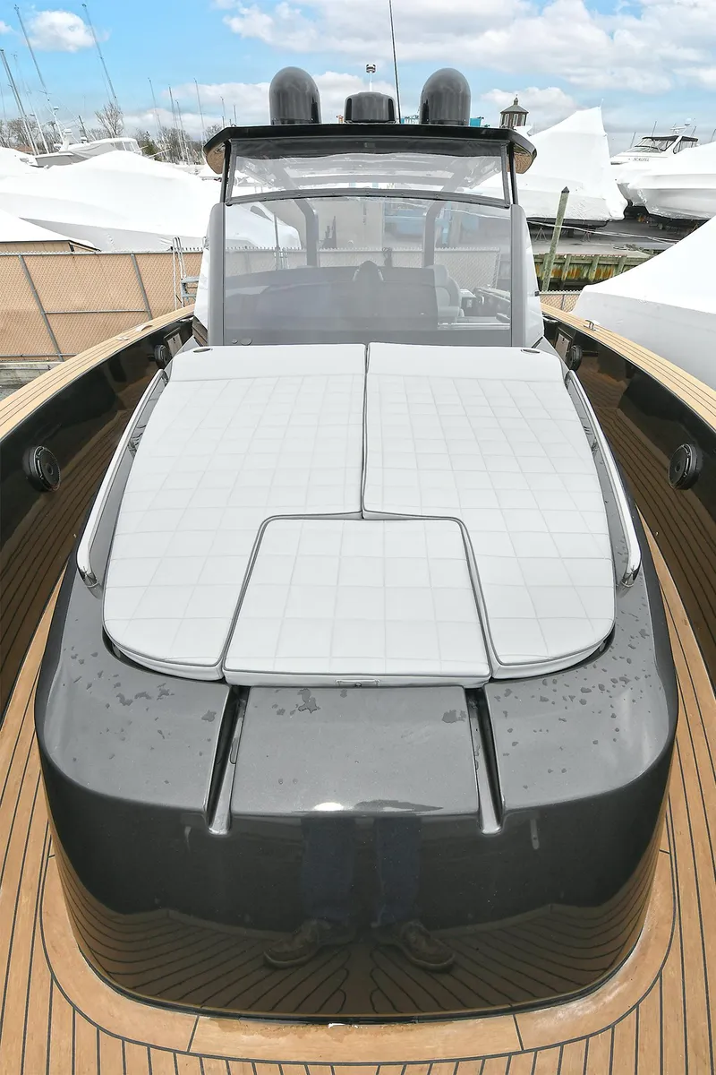 Slide: The Image of 2023 Pardo Yachts 43, sleek design, luxury deck, modern features, docked under blue sky. - 21