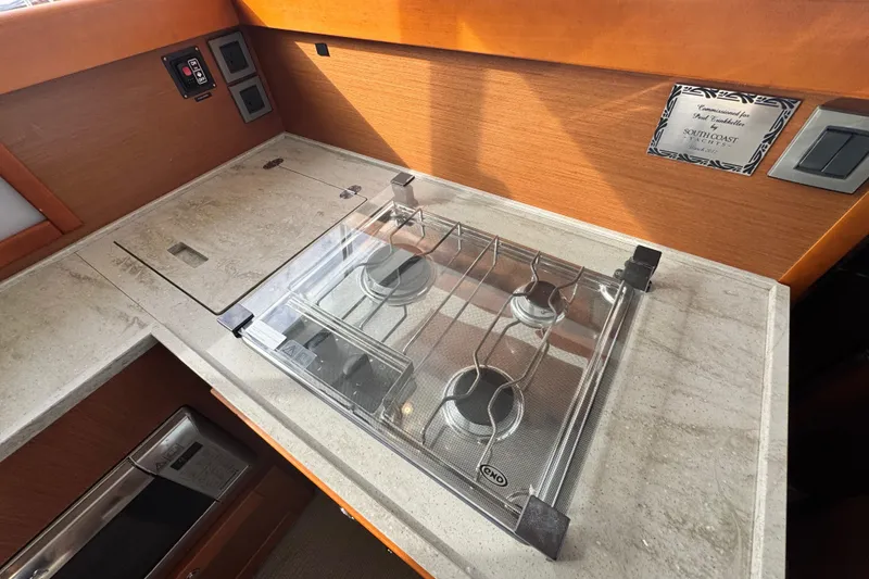 Slide: The Image of 2017 Beneteau Swift Trawler 44 kitchen with stove and countertop. - 11