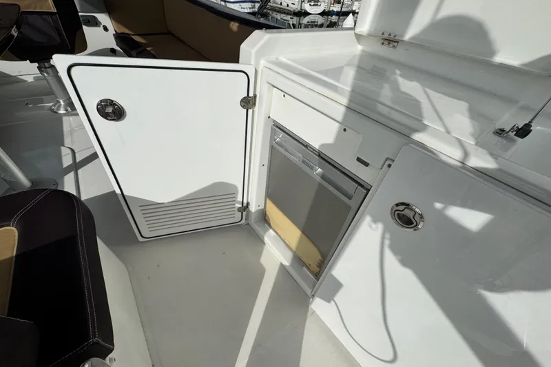 Slide: The Image of 2017 Beneteau Swift Trawler 44 interior with open storage and seating area. - 13