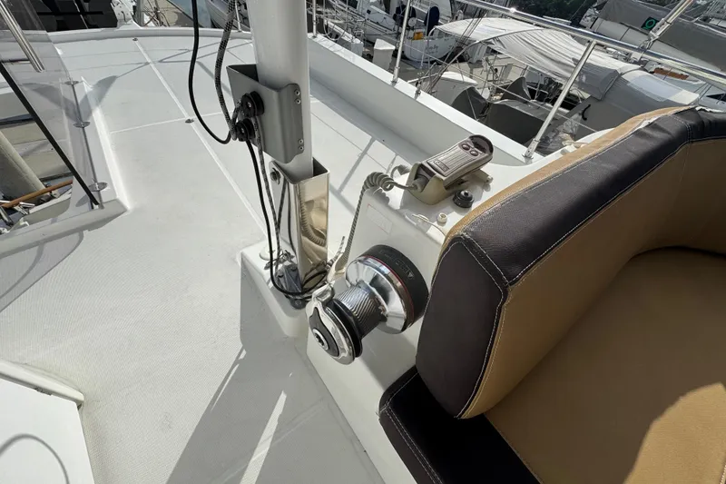 Slide: The Image of 2017 Beneteau Swift Trawler 44 deck with winch and seating area. - 17