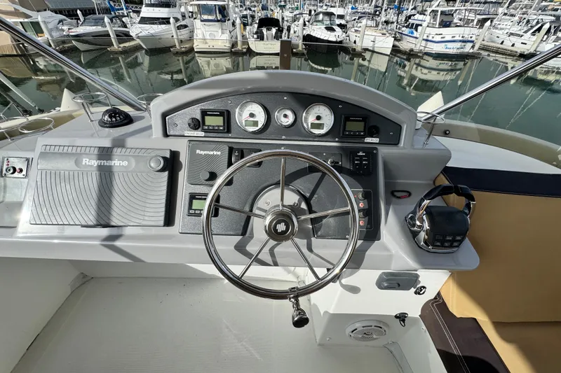 Slide: The Image of Helm of 2017 Beneteau Swift Trawler 44 with Raymarine navigation system, docked at marina. - 20