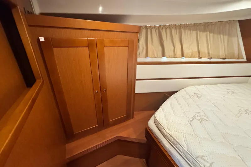 Slide: The Image of Interior cabin of 2017 Beneteau Swift Trawler 44 with wooden cabinetry and bed. - 29