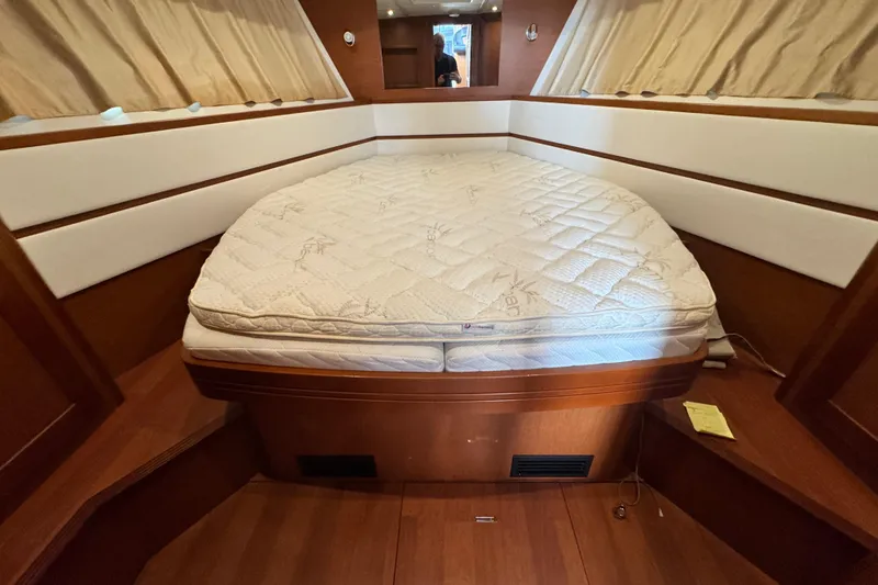 Slide: The Image of Interior cabin of 2017 Beneteau Swift Trawler 44 with a comfortable bed. - 30