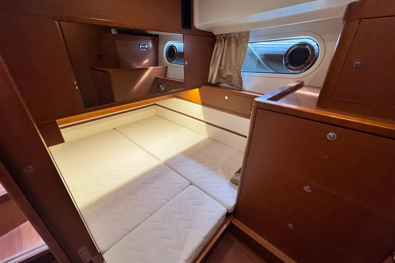 Slide: The Image of Cozy cabin interior of 2017 Beneteau Swift Trawler 44 with wooden furnishings. - 33