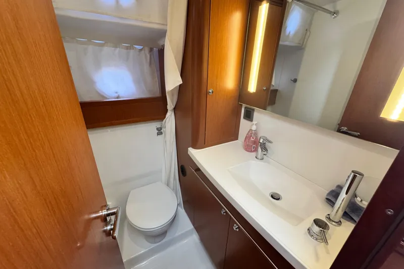 Slide: The Image of Bathroom interior of 2017 Beneteau Swift Trawler 44, featuring sink and toilet. - 34