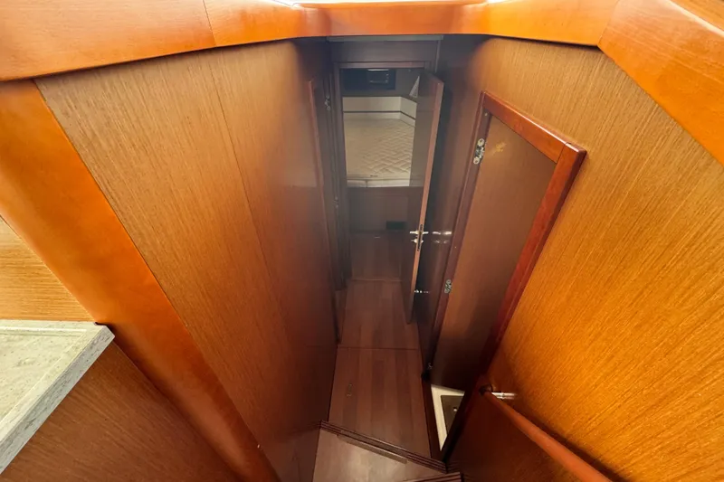 Slide: The Image of Interior hallway of 2017 Beneteau Swift Trawler 44 with wooden finish. - 35