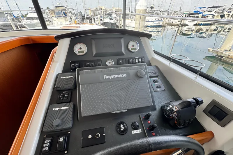 Slide: The Image of Helm of 2017 Beneteau Swift Trawler 44 with Raymarine navigation system, docked at marina. - 36