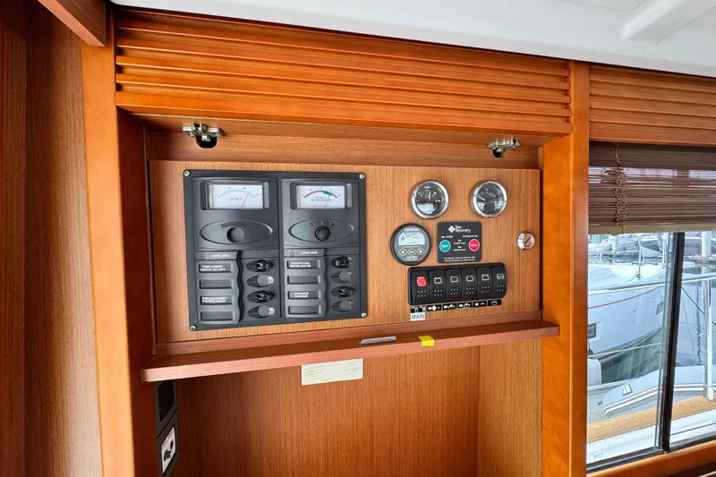 Slide: The Image of Control panel of a 2017 Beneteau Swift Trawler 44, featuring gauges and switches. - 48
