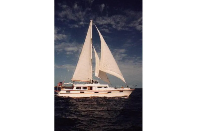 Slide: The Image of Sailing yacht on open sea, Custom model 60, 1985, under clear sky. - 2