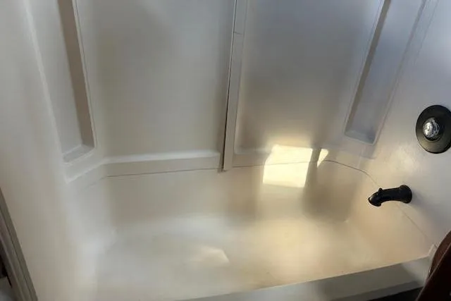 Slide: The Image of White bathtub with built-in shelves, Custom model 60, 1985 design. - 20